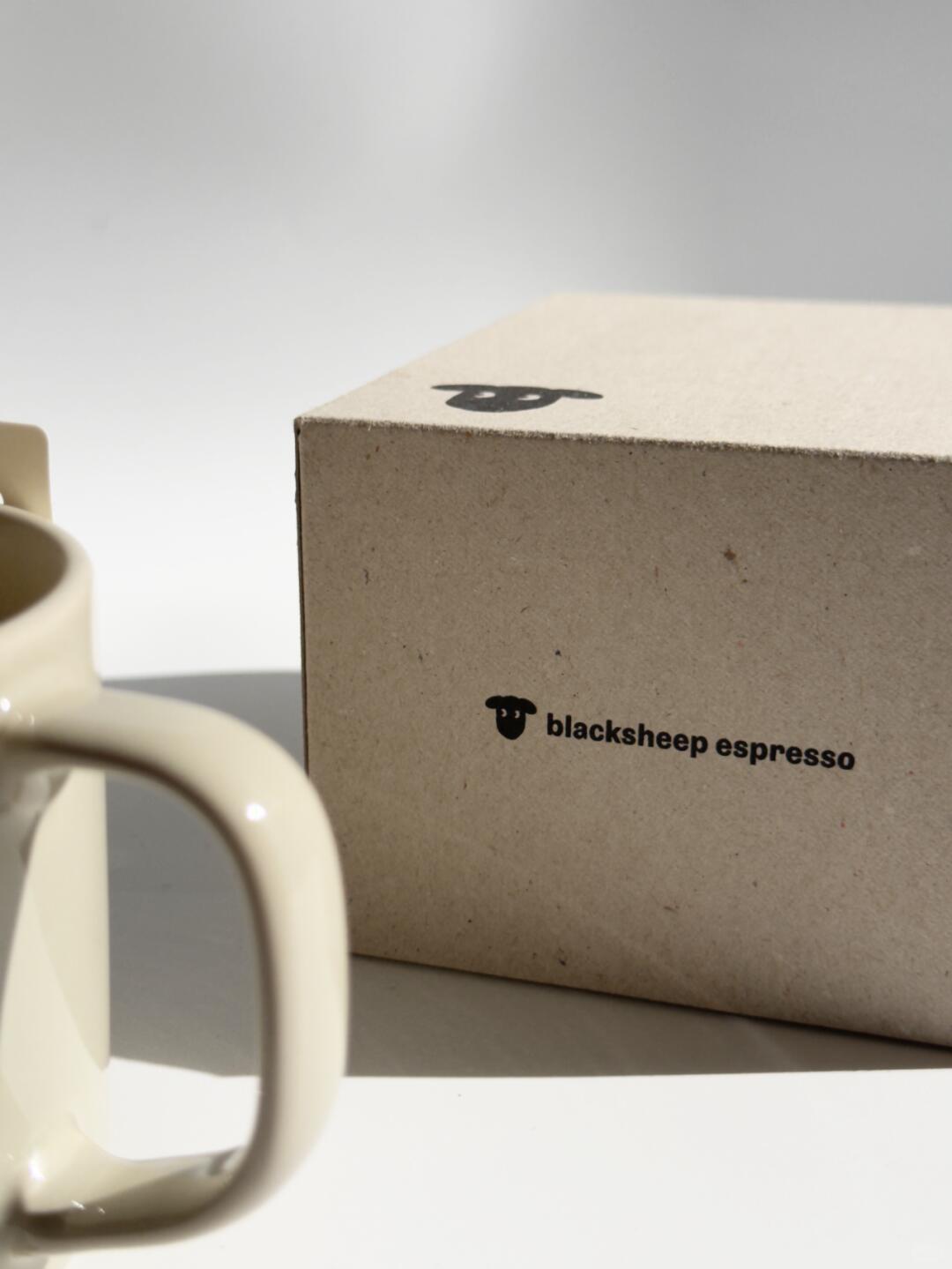 Blacksheep Espresso wordmark on greyboard coffee packaging