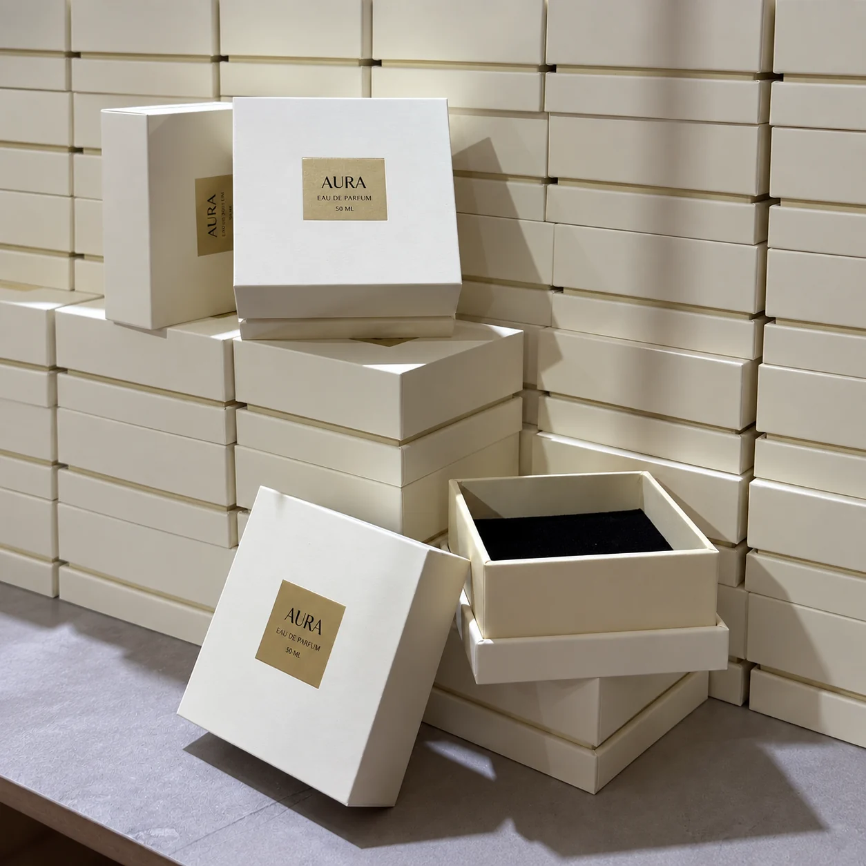 Cream rigid perfume boxes with black fitted insert