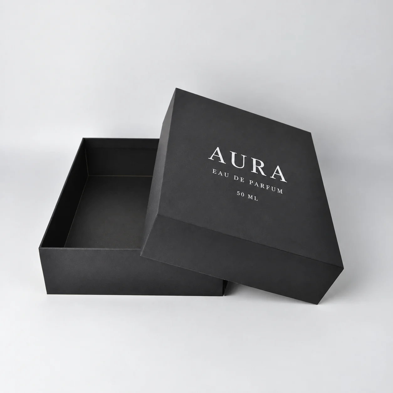 Matte black lid and base perfume box open view