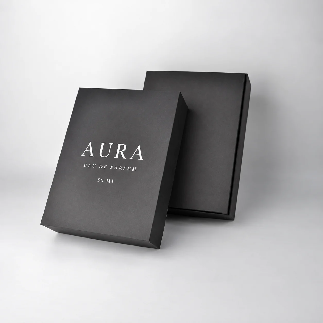 Matte black rigid perfume box with white logo