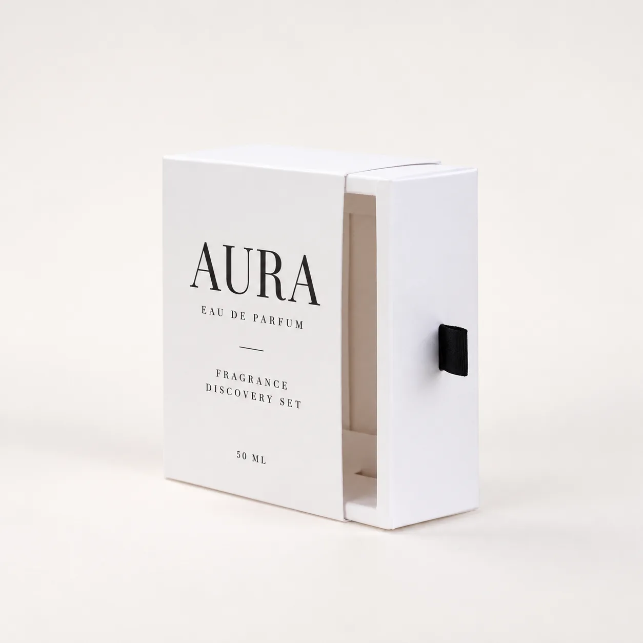 Minimal white sliding perfume box with black ribbon pull