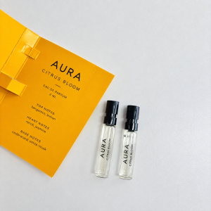 Orange folding perfume sample card with two 2ml vial references