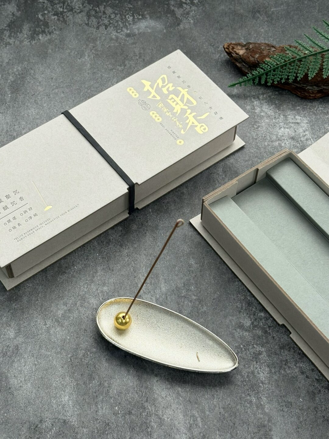 Ivory Incense Gift Box with Gray-Green Paper Insert: close-up of the gold-tone lettering on the light outer panel