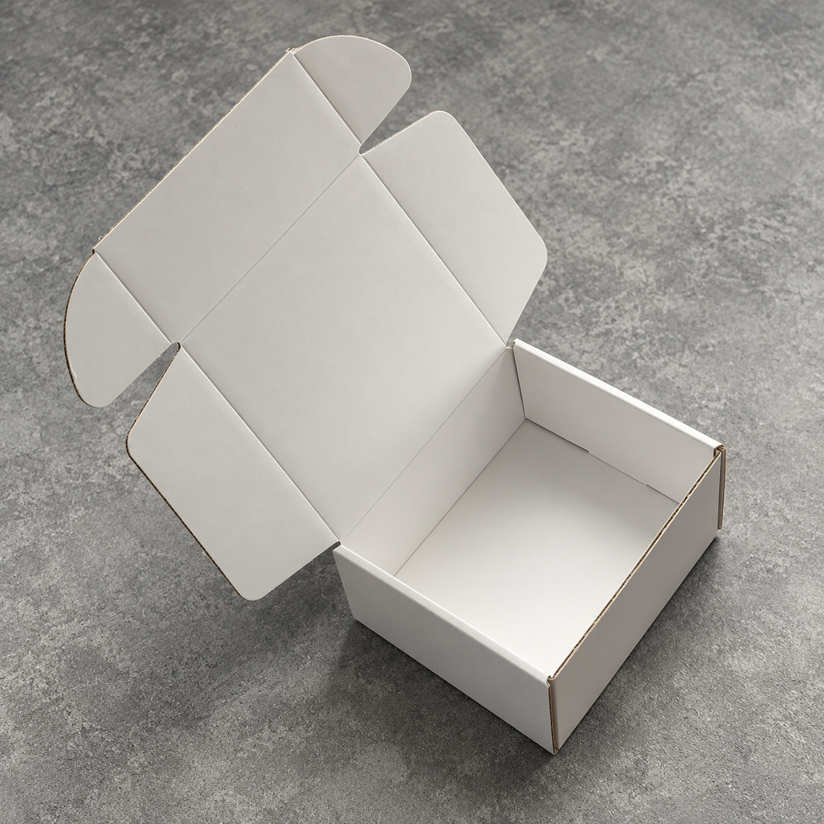 White Blind-Imprint Fold-Flat Mailer Box: close-up of the paper surface, finish and folded edge