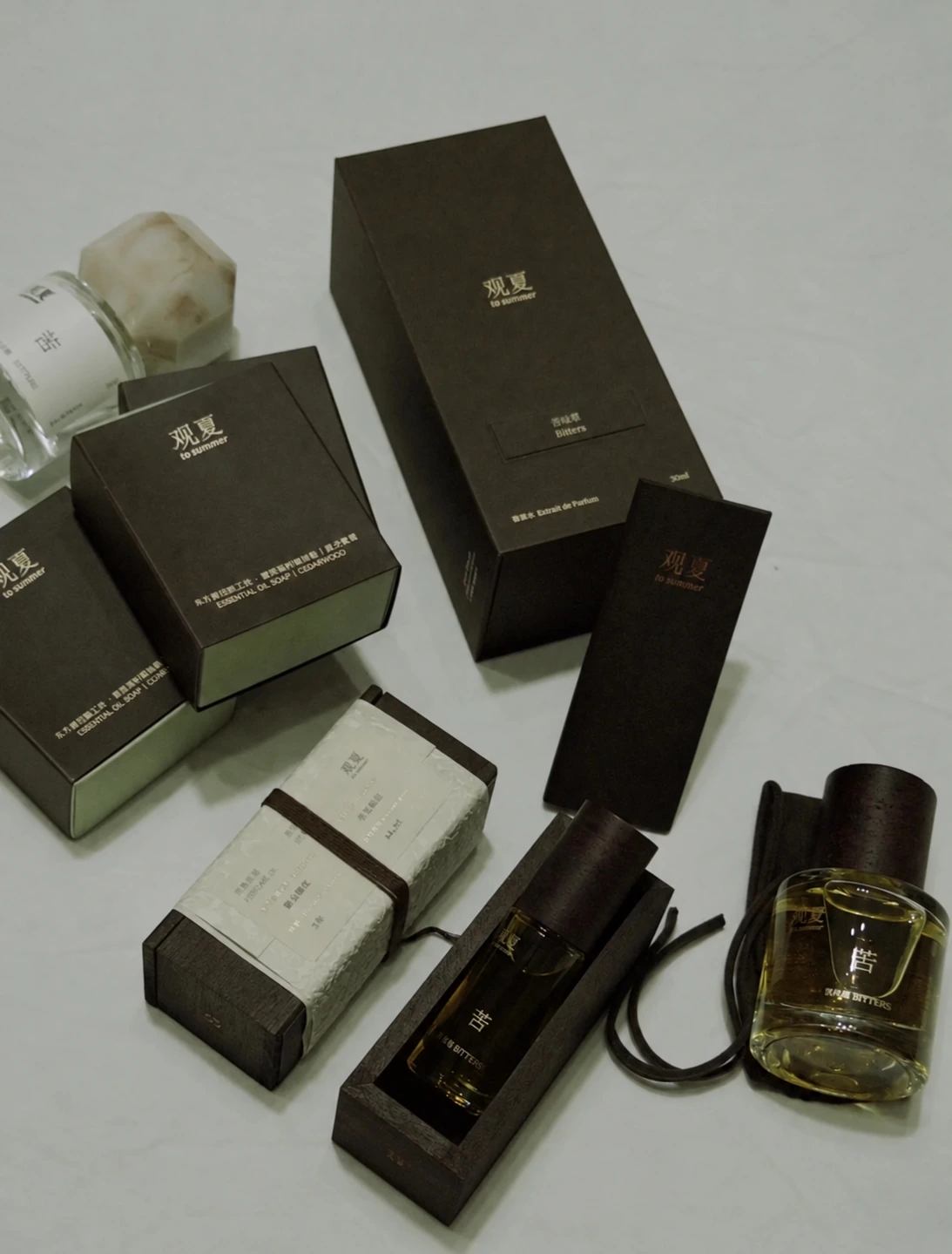A collection of fragrance boxes and accompanying packaging components
