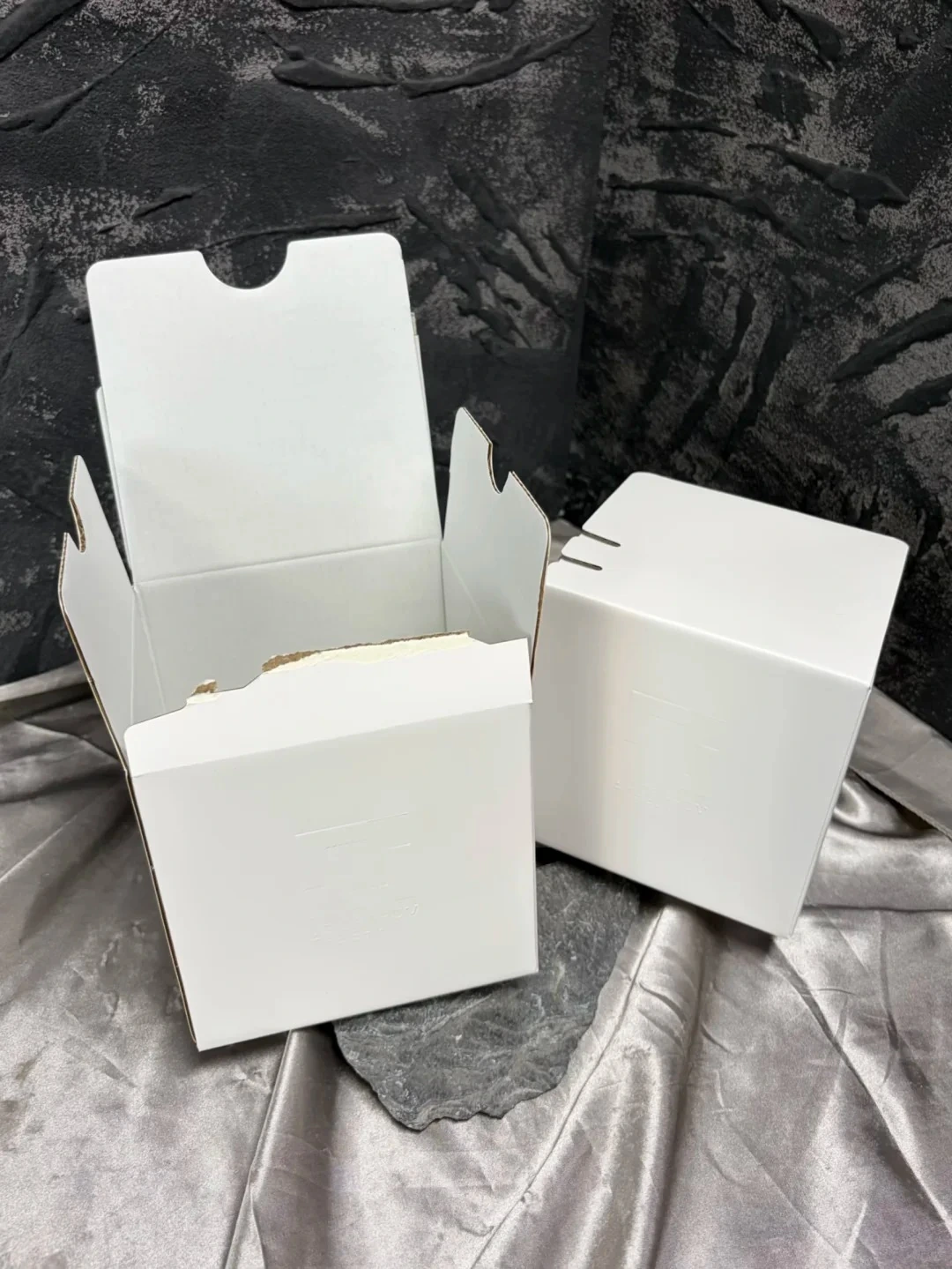 White cartons showing closed and tear-open configurations