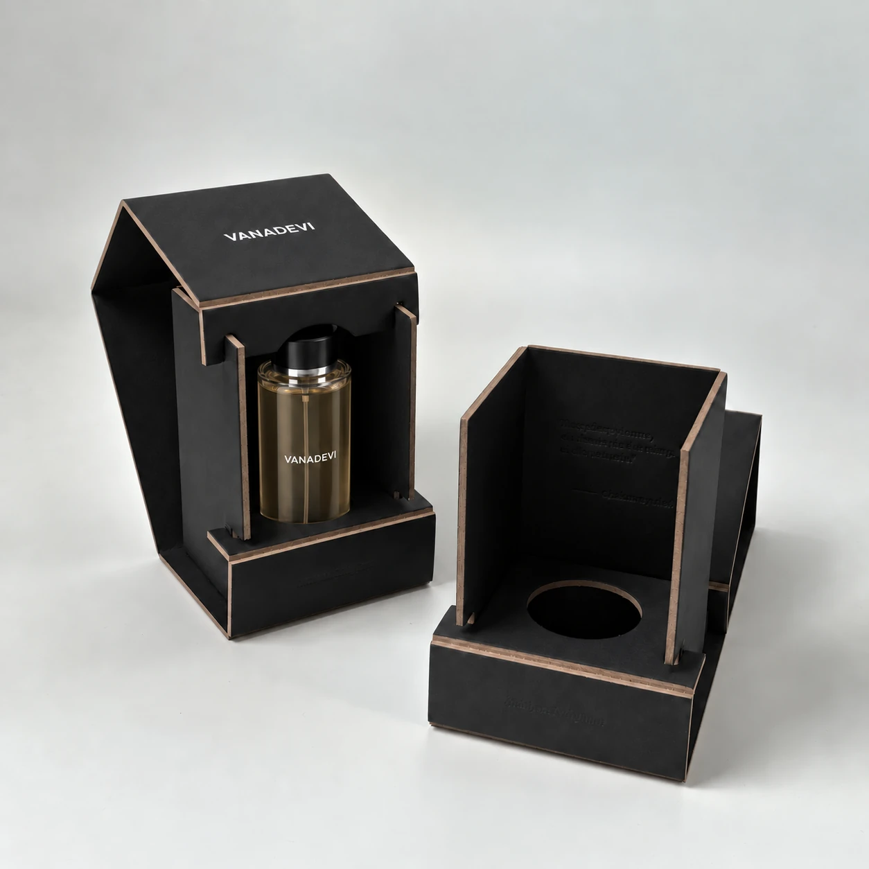 Black 2-piece foldable grayboard perfume box with a bottle seated through the circular locating insert