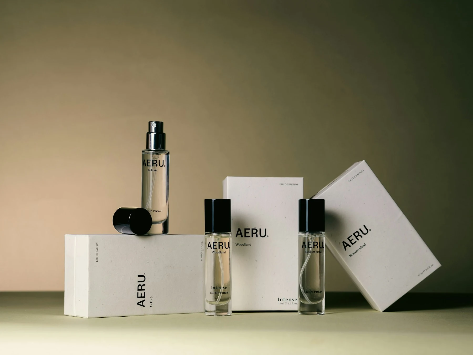 AERU perfume bottles with fitted caps and matching printed cartons