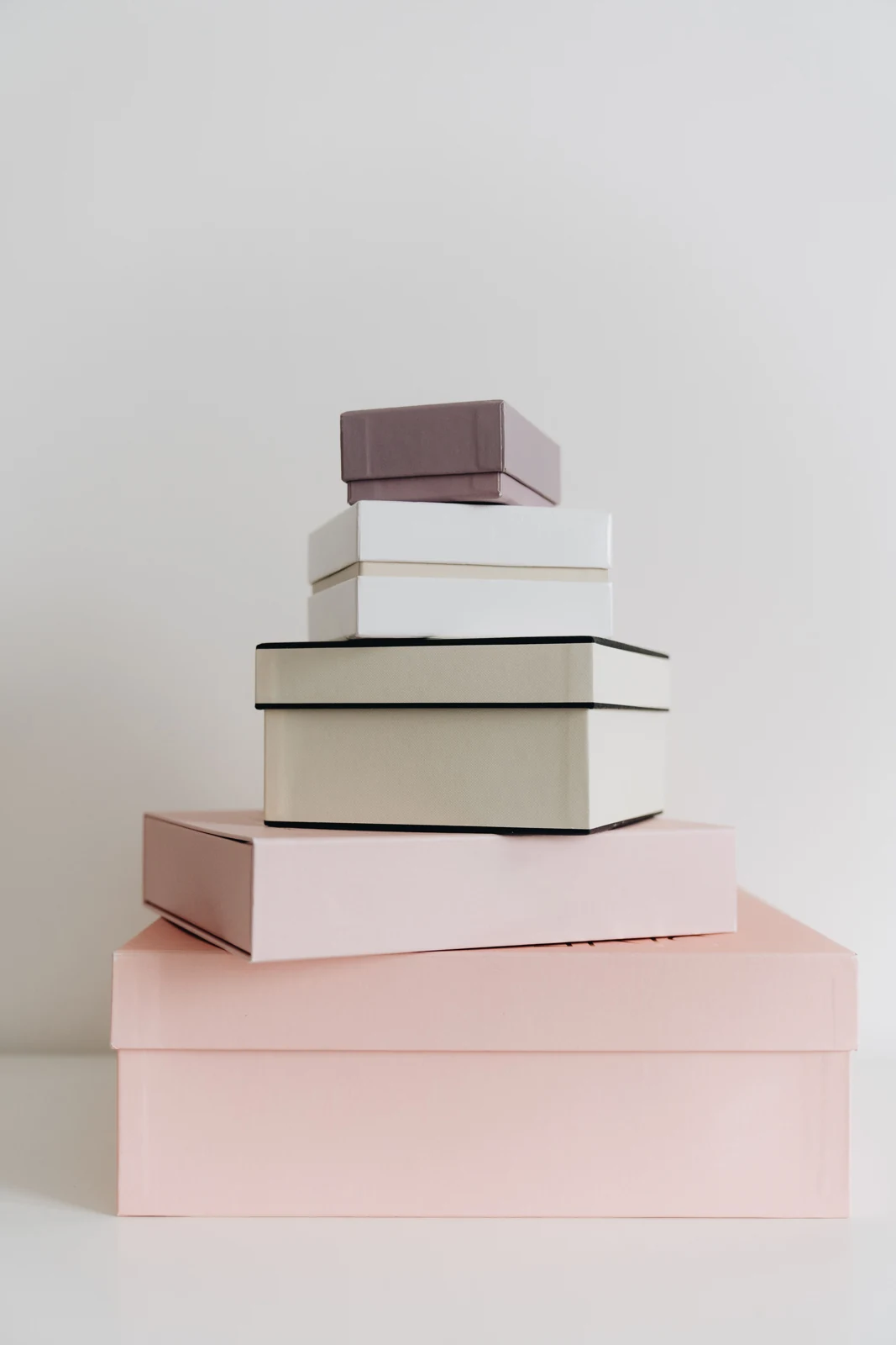 A stack of closed gift boxes in different sizes