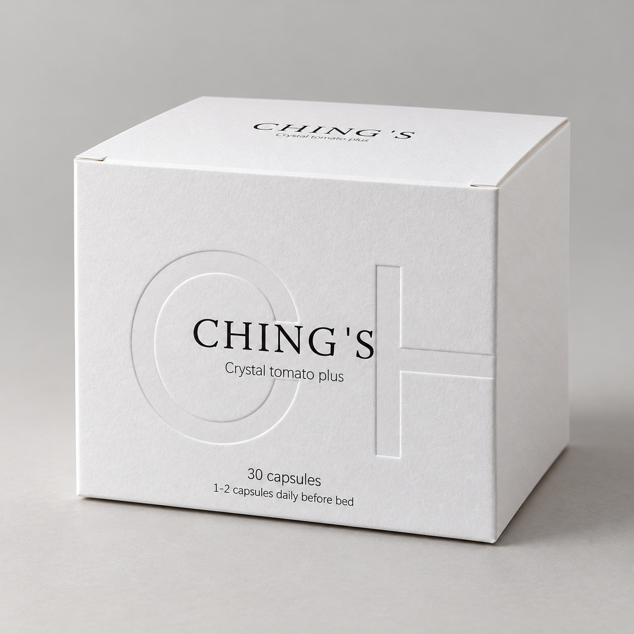 White Debossed Folding Carton Gift Box: closed white carton with dark typography and large colorless debossed letterforms