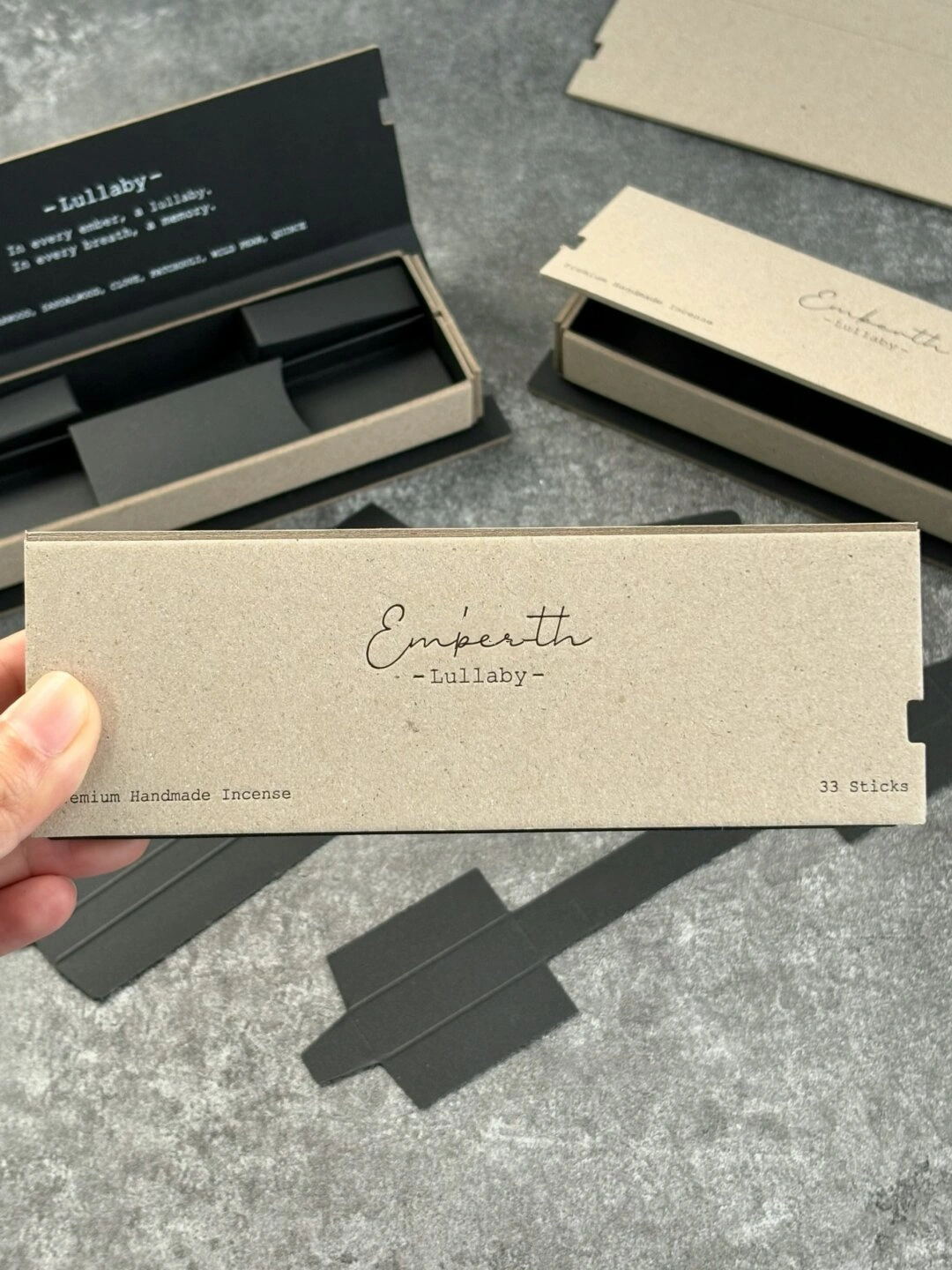Natural Paper Book-Style Incense Box with Black Insert: closed natural-paper book-style incense box with dark script typography