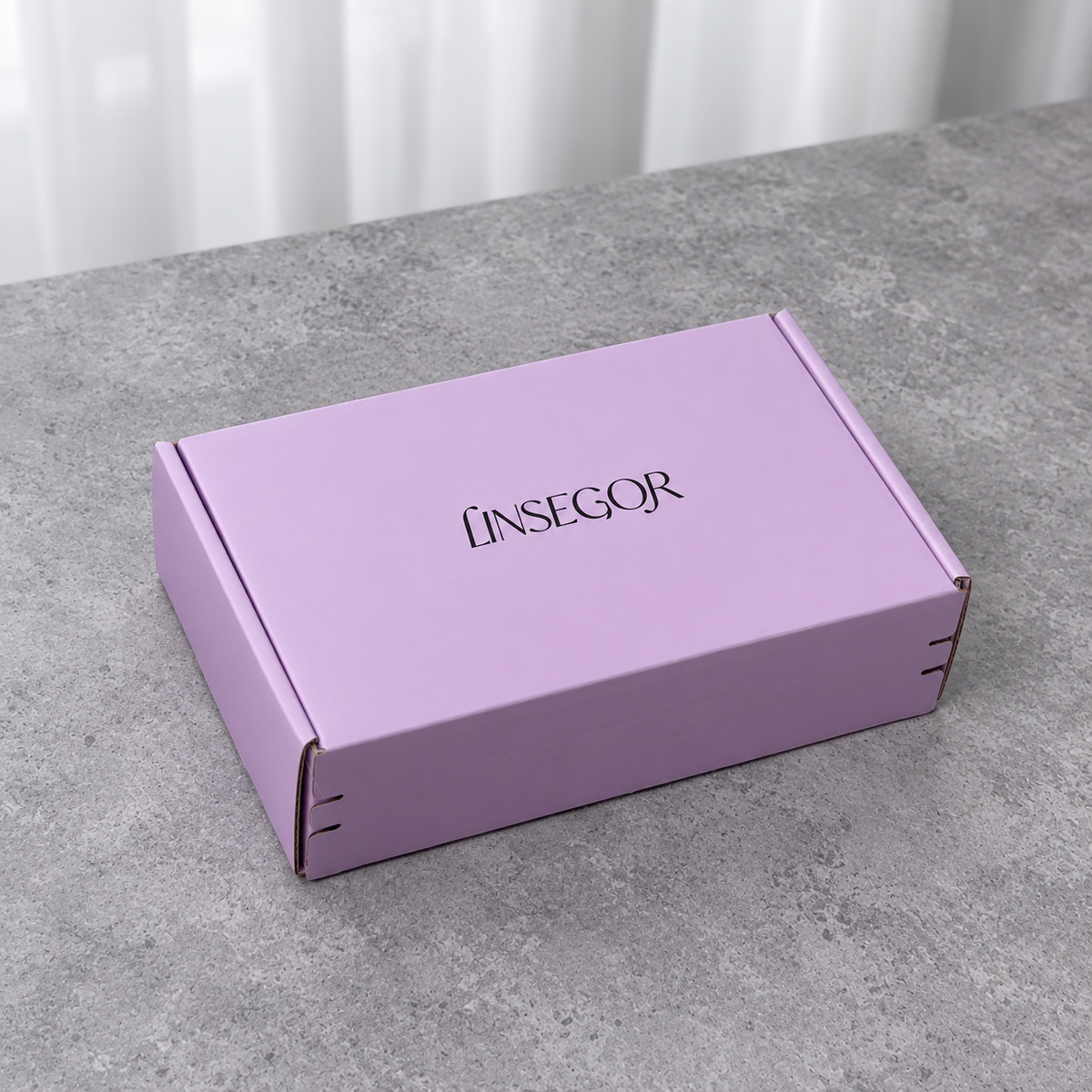 Lavender Tear-Strip Fold-Flat Mailer Box: closed box showing the exterior printing and lid