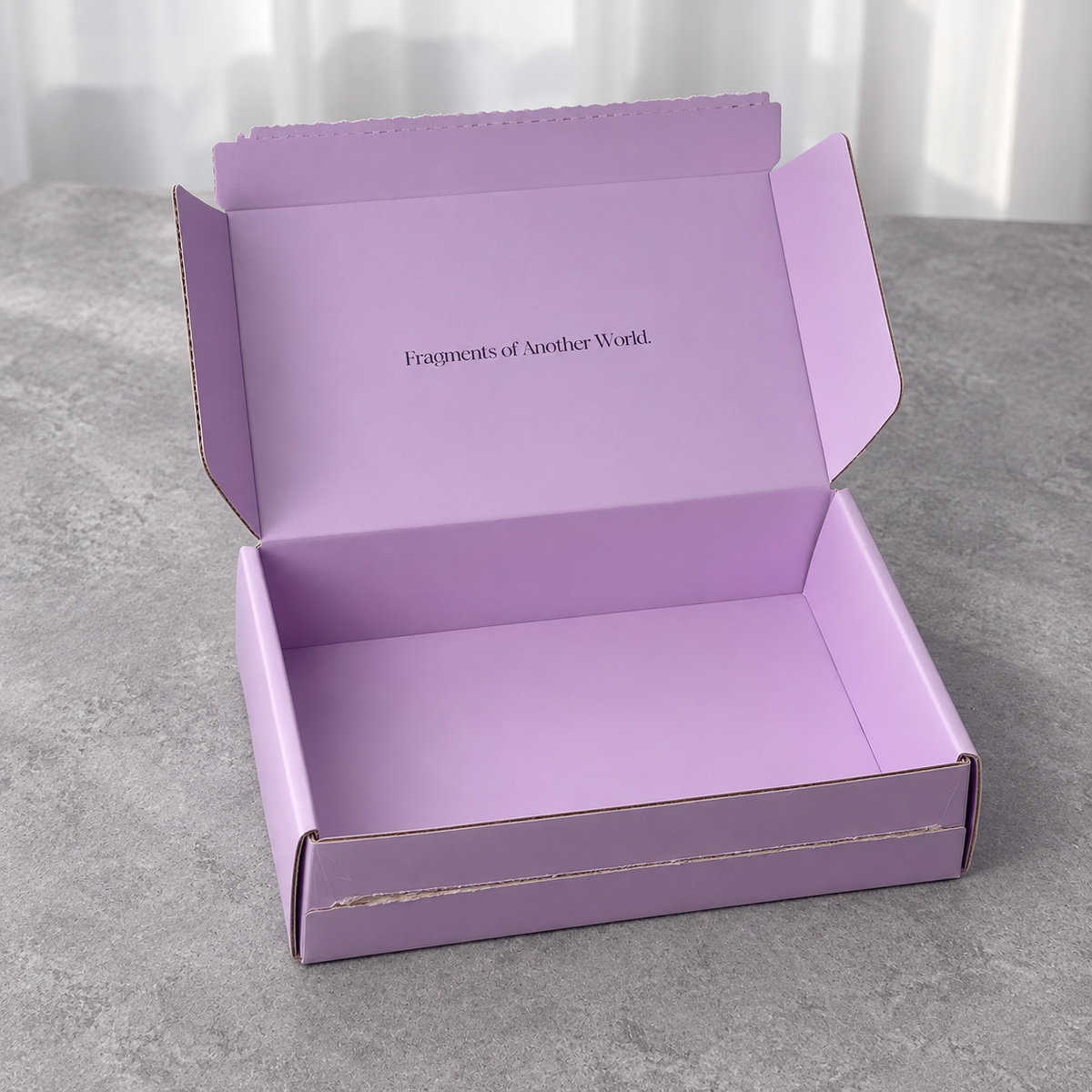 Lavender Tear-Strip Fold-Flat Mailer Box: open box showing the interior and folding lid structure