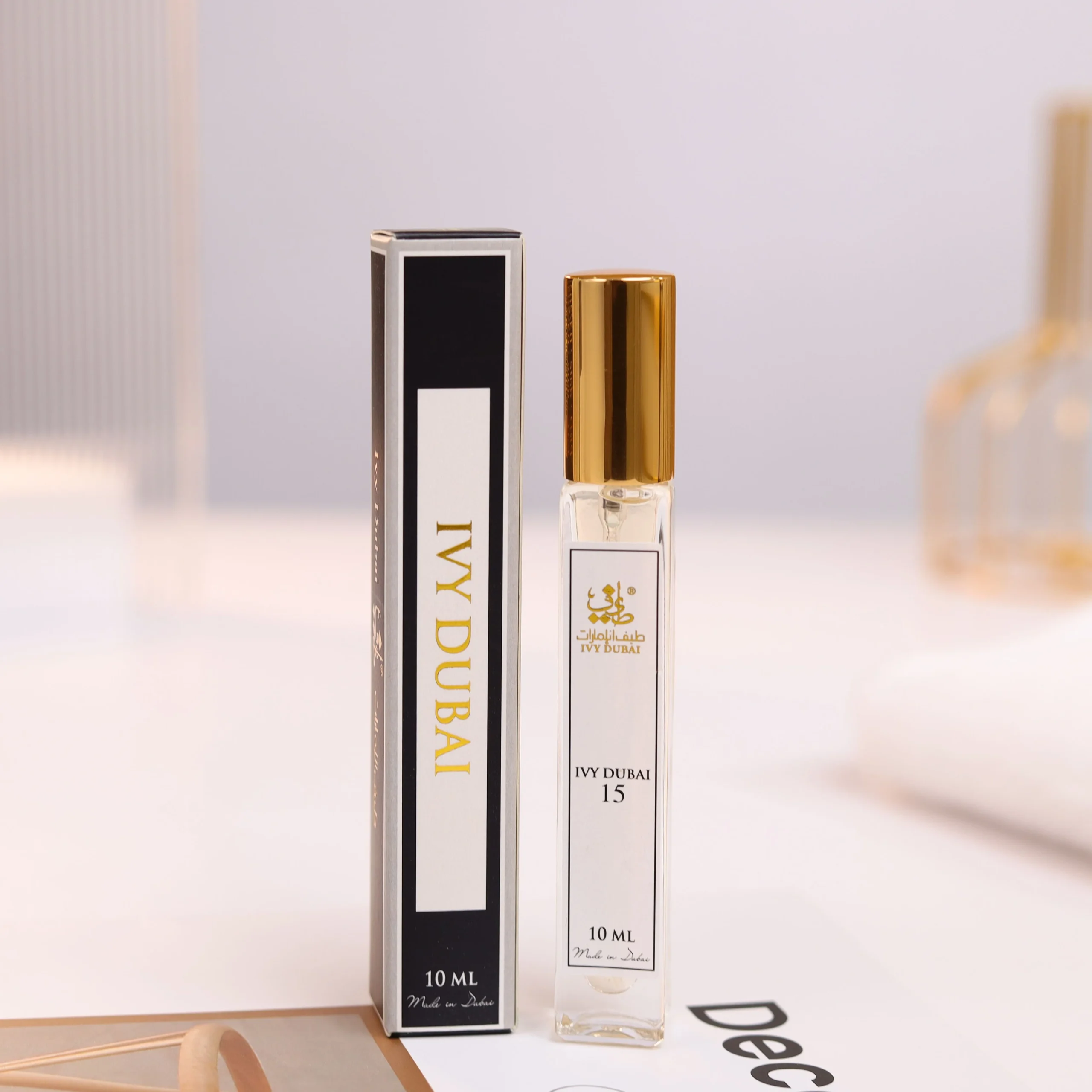 An IVY DUBAI perfume bottle beside its printed retail carton