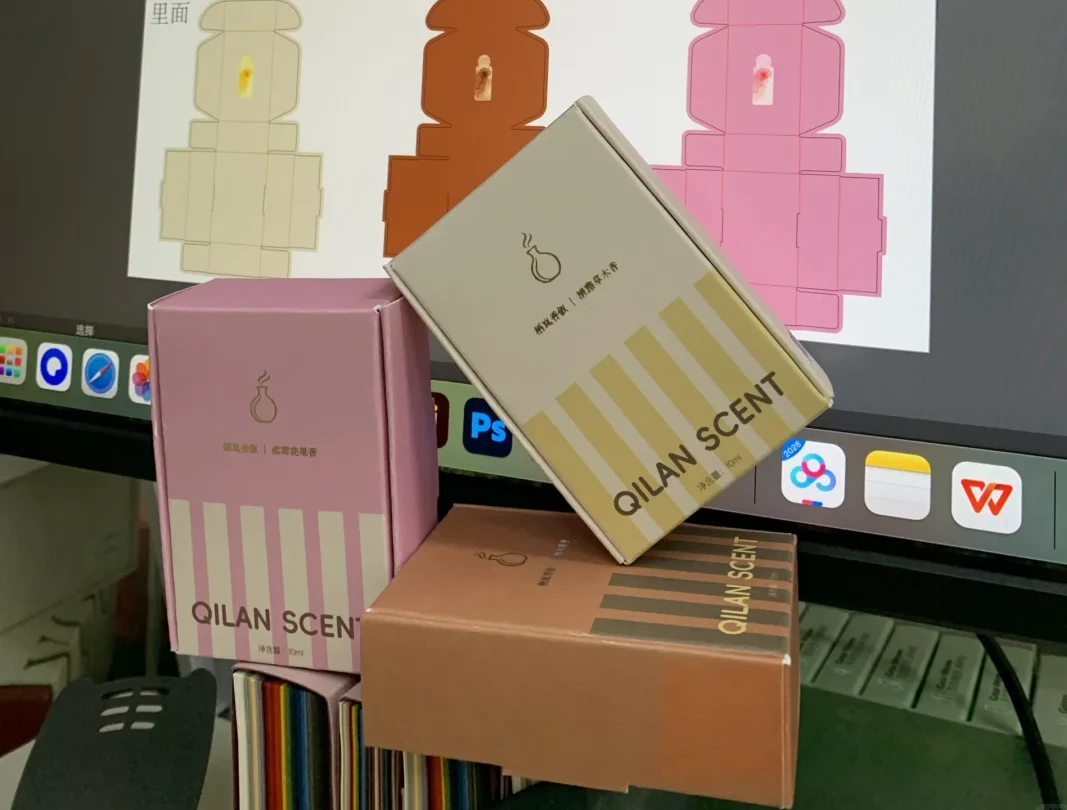 Three fragrance carton concept samples beside their flat artwork