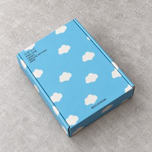 Sky Blue Cloud Print Fold-Flat Mailer Box: closed box showing the exterior printing and lid