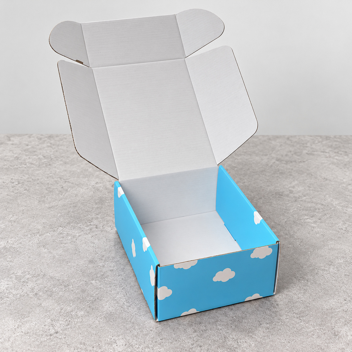 Sky Blue Cloud Print Fold-Flat Mailer Box: open box showing the interior and folding lid structure