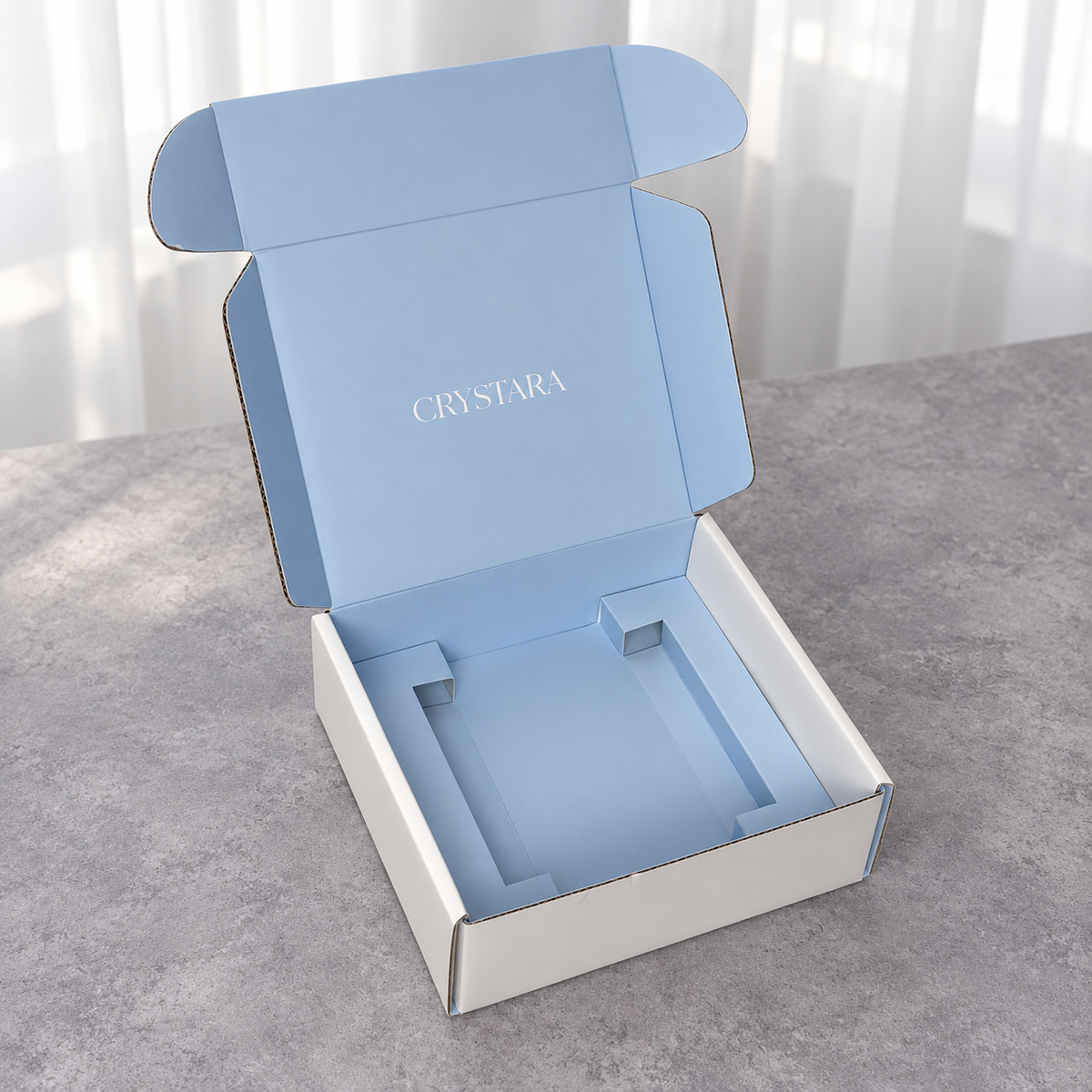 Open white mailer showing a light blue interior and matching paper insert