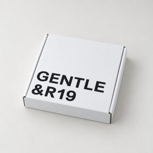 Closed white folding mailer box with bold black logo printing