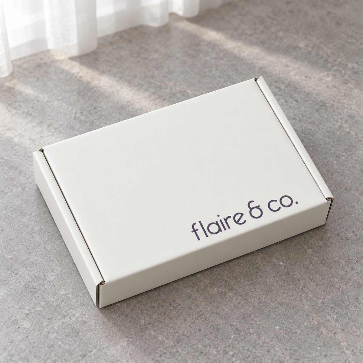 White Tear-Strip Mailer Box with Lavender Interior: closed box showing the exterior printing and lid